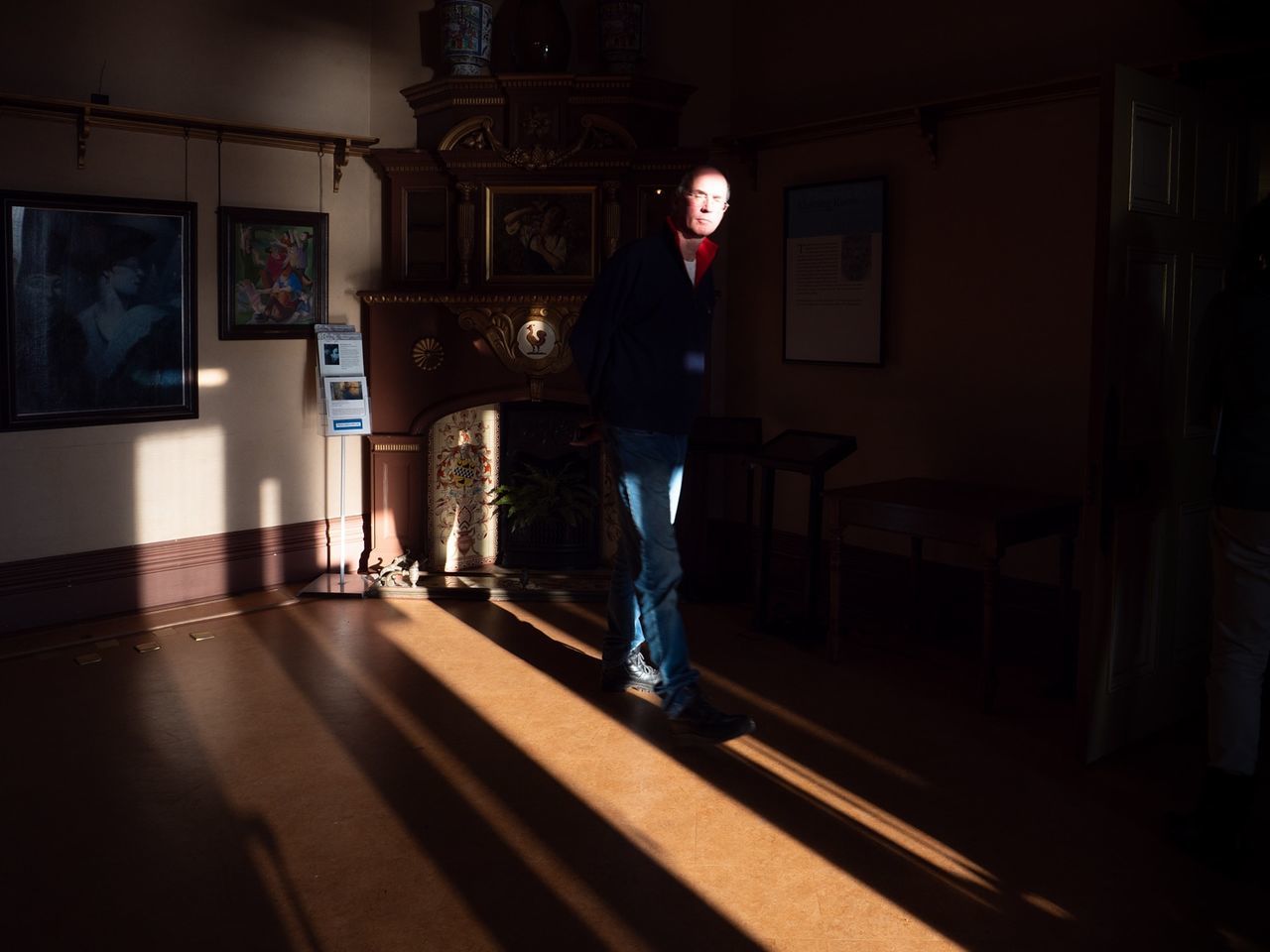 standing, one person, real people, full length, lifestyles, sunlight, indoors, casual clothing, home interior, men, architecture, shadow, young adult, built structure, adult, leisure activity, young men, house, dark, contemplation