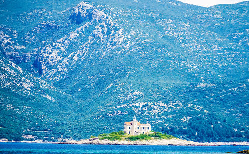 Scenic view of sea against blue sky