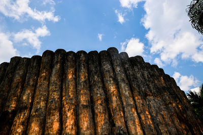 Low angle view of tree mountain against sky