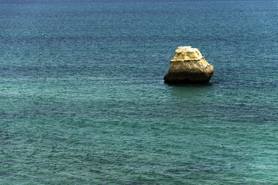 Scenic shot of headland in calm blue sea