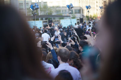 Crowd photographing during event