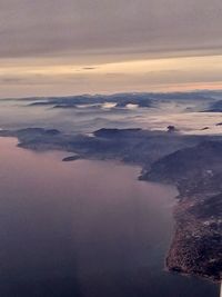 High angle view of sea against sky during sunset