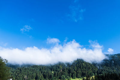 Scenic view of land against blue sky