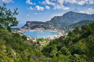 Panoramic shot of townscape by sea against sky