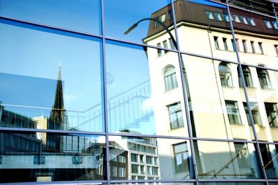 Low angle view of modern buildings against sky