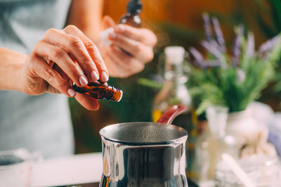 Close-up of hand holding drink