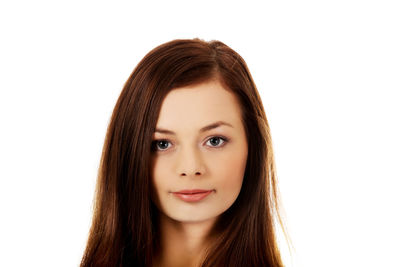 Close-up portrait of a teenage girl against white background