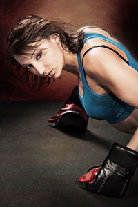 Portrait of woman exercising on floor