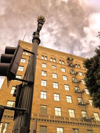 Low angle view of skyscraper against sky