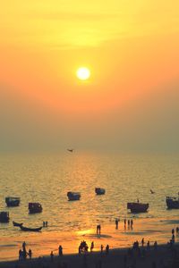 Scenic view of sea against orange sky during sunset