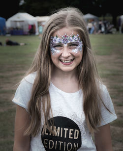 Portrait of smiling girl with face paint