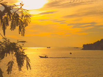 Scenic view of sea against orange sky