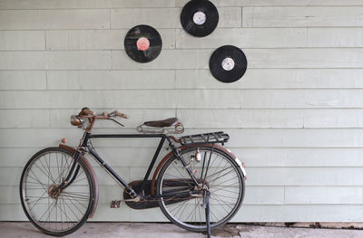 Bicycle parked on wall