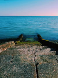 Scenic view of sea against clear blue sky