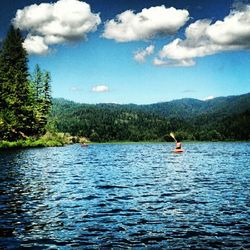 Scenic view of lake with mountains in background