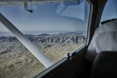 View of landscape through airplane window