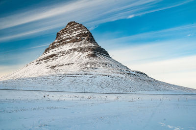 Scenic view of snowcapped mountain against sky