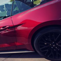 Reflection of red car on windshield