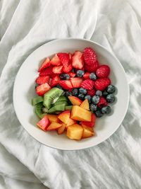 High angle view of strawberries in plate on table