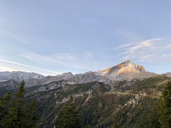 Scenic view of landscape and mountains against sky