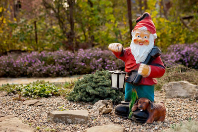 Full length of father with toy against plants