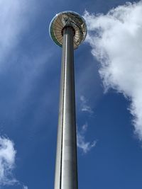 Low angle view of tower against cloudy sky