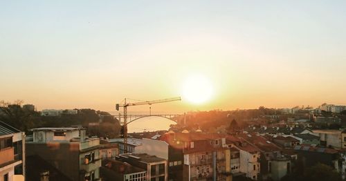 Townscape against sky during sunset