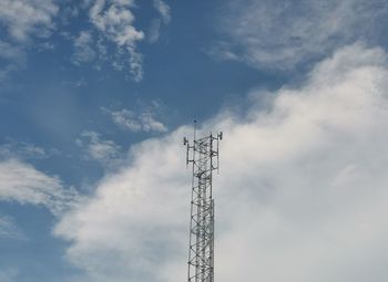 Low angle view of communications tower against sky