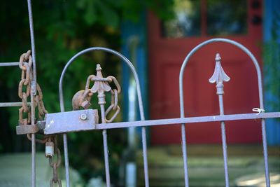 Close-up of rusty chain on gate