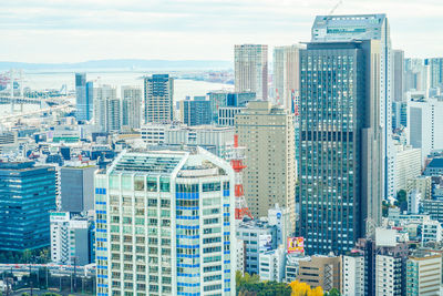 Modern buildings in city against sky