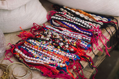 Close-up of multi colored bracelets on table
