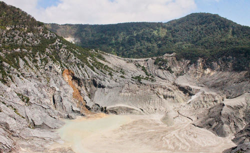 Scenic view of volcanic landscape against sky