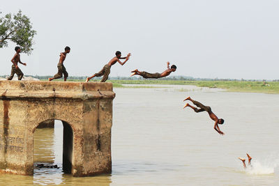 Woman jumping in sea