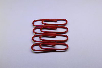 Close-up of colored pencils over white background