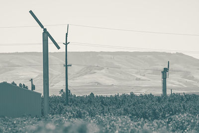 View of wind turbines on landscape