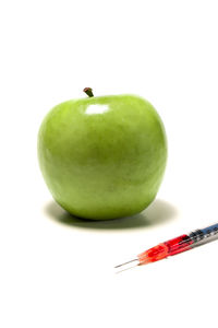 Close-up of apple against white background