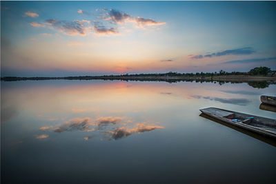 Scenic view of lake against sky during sunset