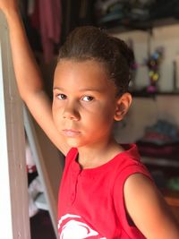 Portrait of cute girl standing at home