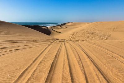 Scenic view of desert against clear sky