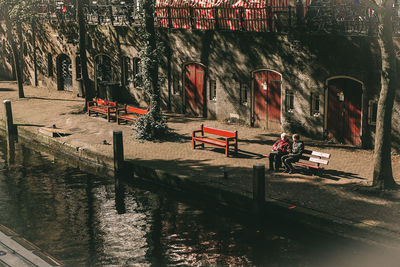 Graffiti on building by canal in city