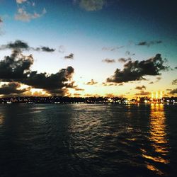 View of illuminated city at sunset