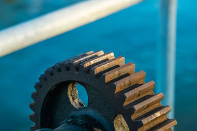 Close-up of wheel against blue sky