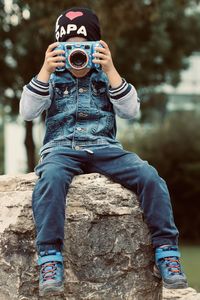 Portrait of boy photographing