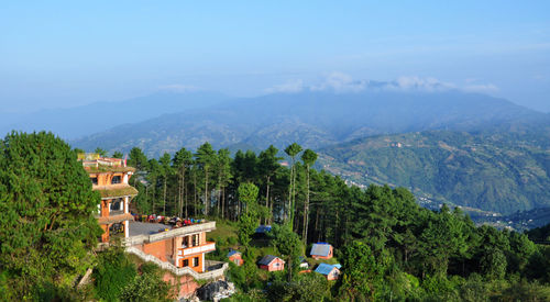 High angle view of mountains against cloudy sky