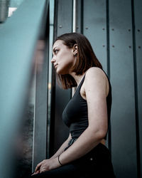 Side view of a young woman looking away