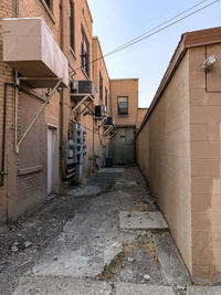 Footpath amidst buildings in town