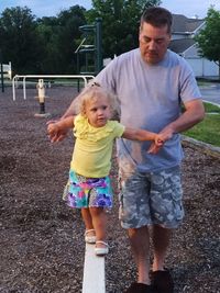 Full length of father and daughter playing