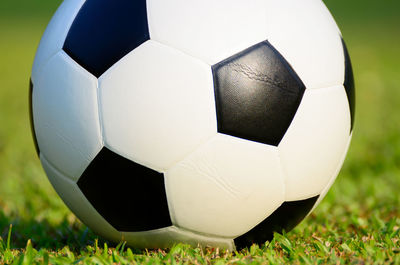 Close-up of soccer ball on field