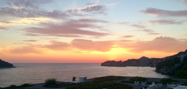 Scenic view of sea against sky at sunset