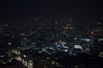 High angle view of illuminated city buildings at night